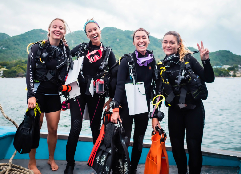 Group of marine conservation students preparing for their Ecological Monitoring Program (EMP) dive with Black Turtle Conservation on Koh Tao, Thailand.