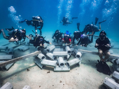 Group of conservation divers completing an artificial reef construction dive as part of the Artificial Reefs course at Black Turtle Conservation, Koh Tao.