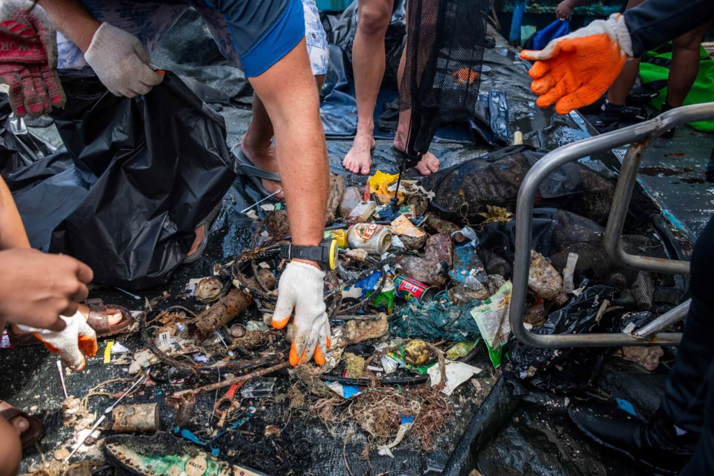 Divers participating in a marine debris assessment dive as part of the Marine Pollution monitoring course at Black Turtle Conservation, Koh Tao.