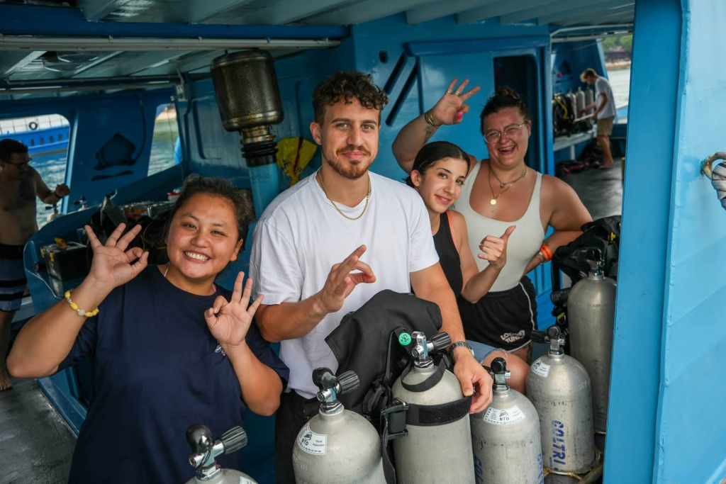blackturtleconservation.com-open-water-diver-course-tropical-reef-koh-tao-thailand Newly certified diver exploring tropical coral reefs during an Open Water course in Koh Tao, Thailand.