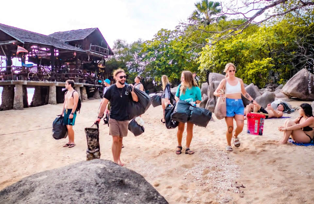 Students conducting a plastic pollution assessment as part of a marine conservation research program on Koh Tao.