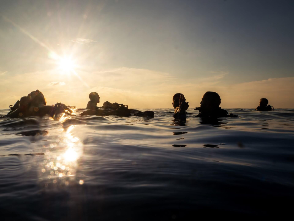 Rescue Diver students developing surface awareness and team communication skills during rescue training dives in Koh Tao.