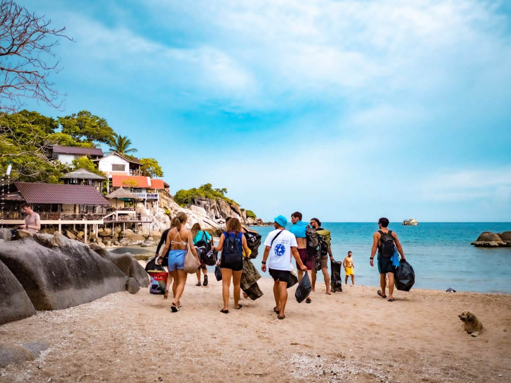Community members recording marine pollution data during a weekly monitoring and conservation event in Koh Tao, Thailand.