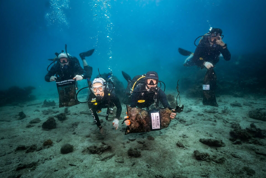 Underwater conservation surveys conducted by divers during Ocean Aware Week in Koh Tao, supporting local marine research.